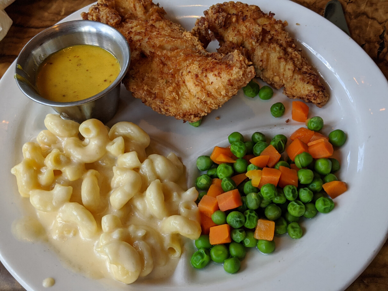 chicken tenders, peas & carrots, mac & cheese and dipping sauce 
