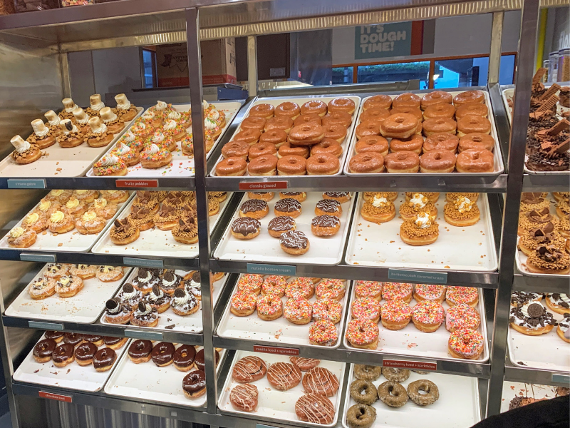 display case featuring all the donut varieties